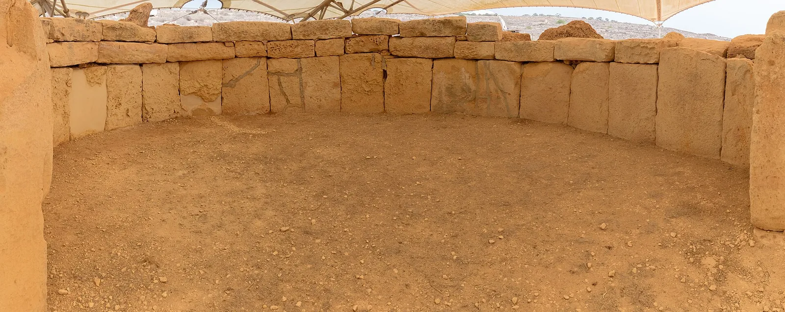 Interior apse of Mnajdra temple with its curved stone wall